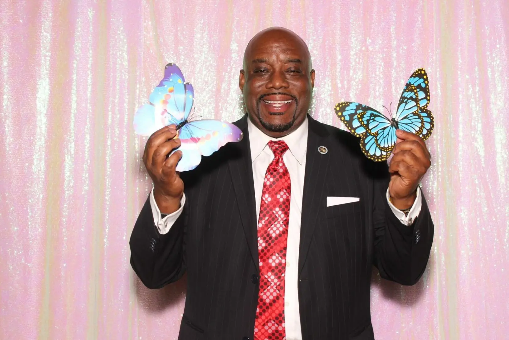 Mayor holding butterflies artifacts